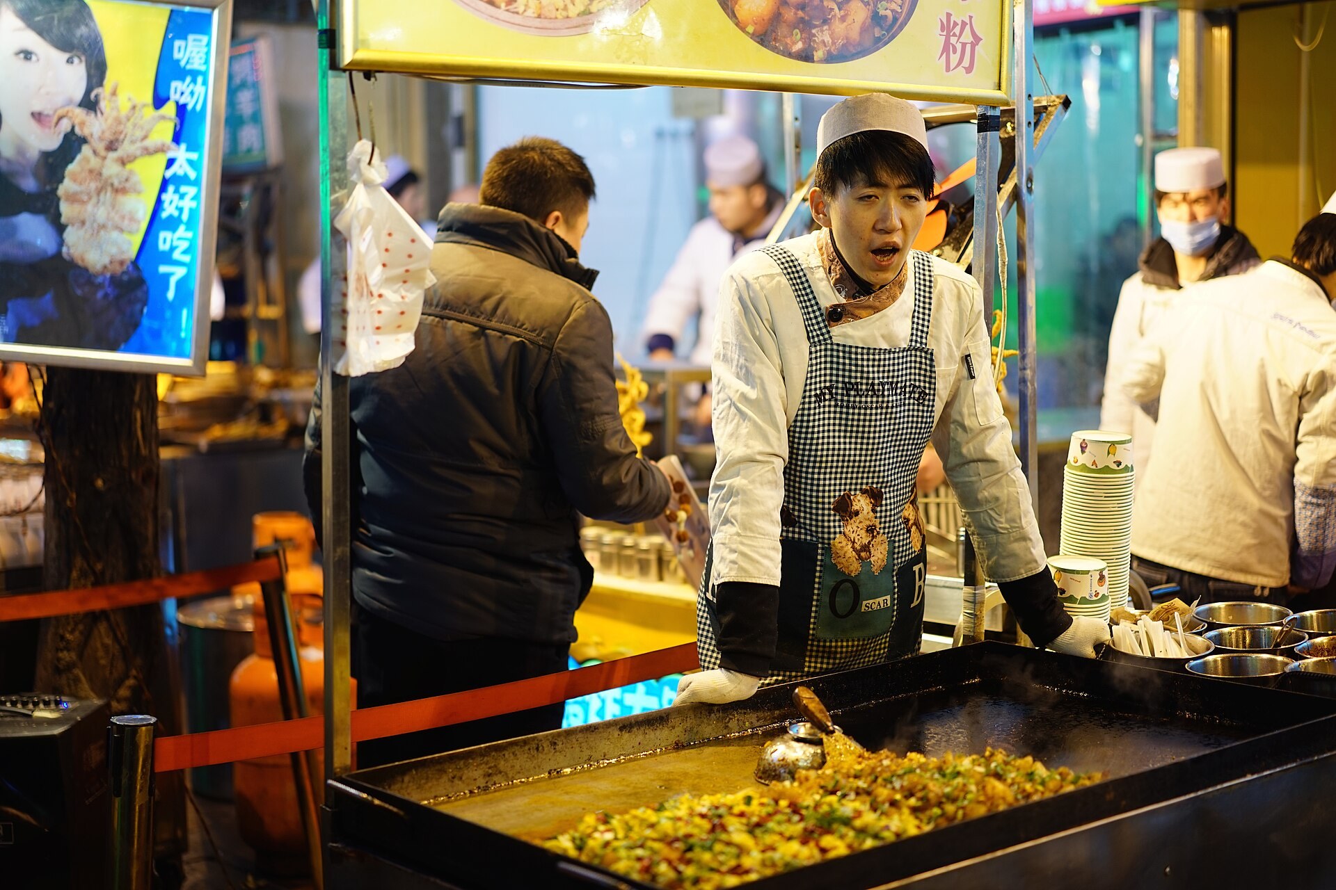 A street-food vendor working at a night market in Xi’an.