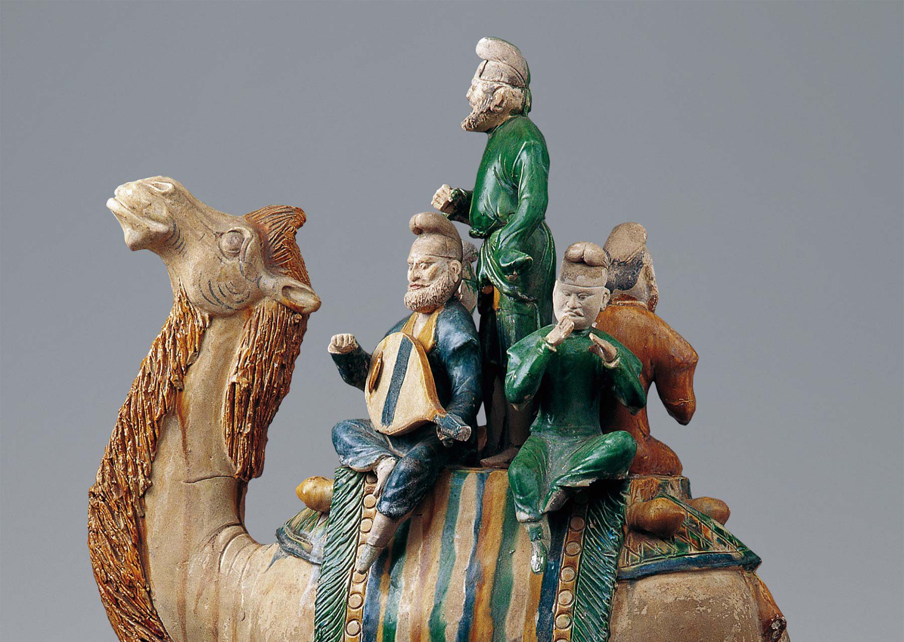 A Tang-period ceramic camel carrying a group of musicians.