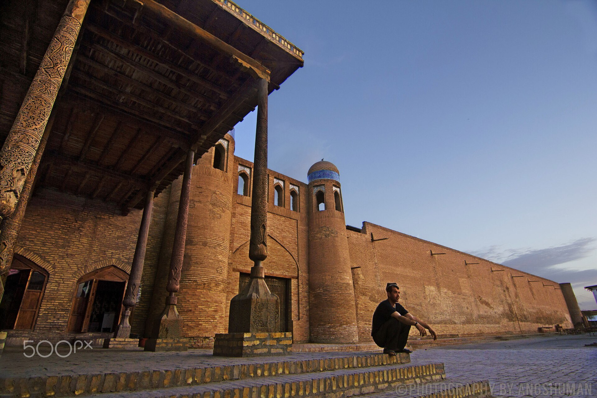 The mud-brick walls of Khiva at dawn.